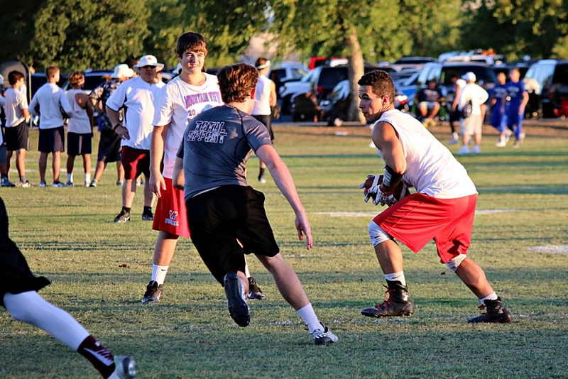 Football team members play on the field